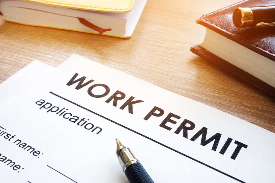 Work permit application on a table.